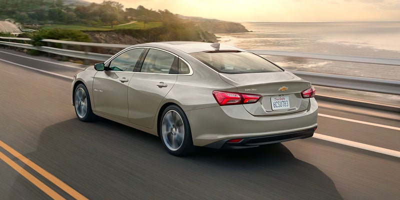 2025 Chevrolet Malibu driving along the coast